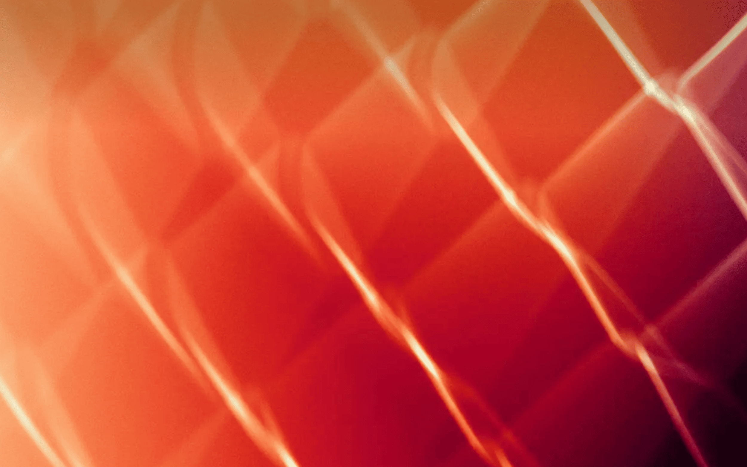 Orange lines forming a mesh shape on red background