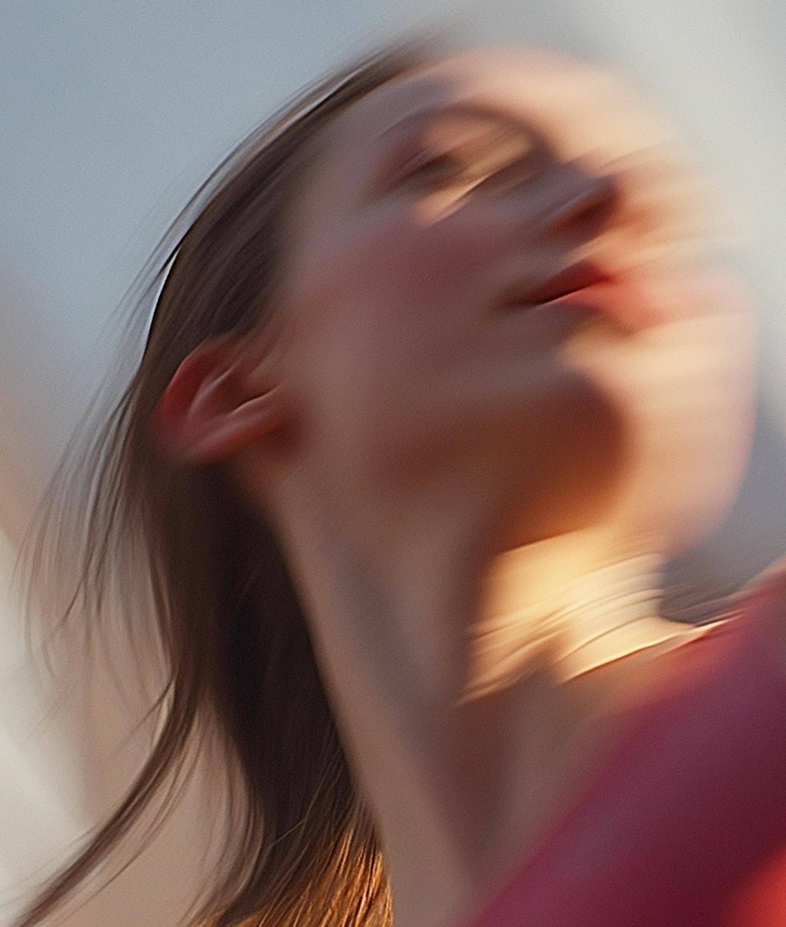 Blurred portrait of a woman looking up