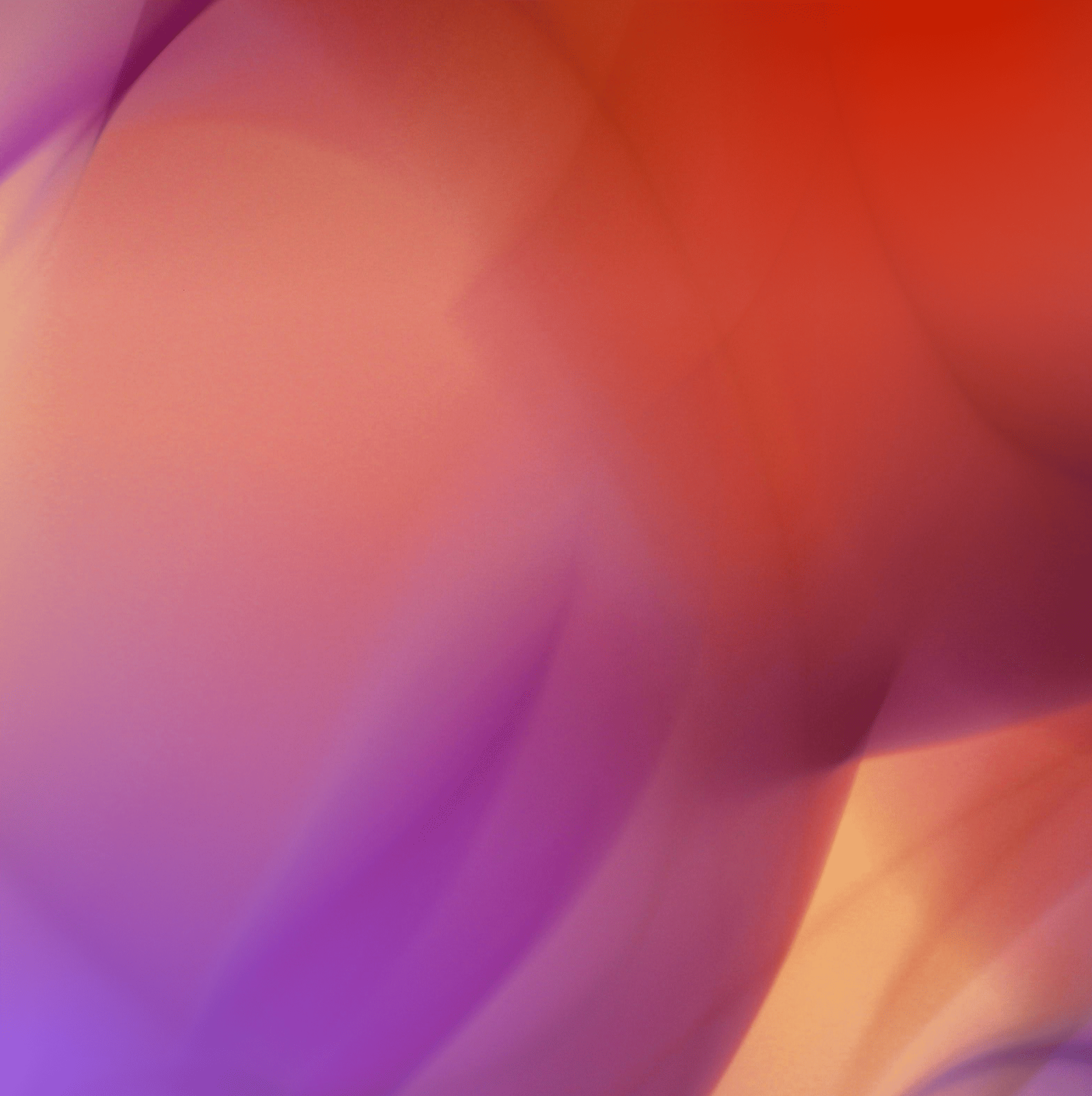 Abstract gradient background with red, orange, and purple hues