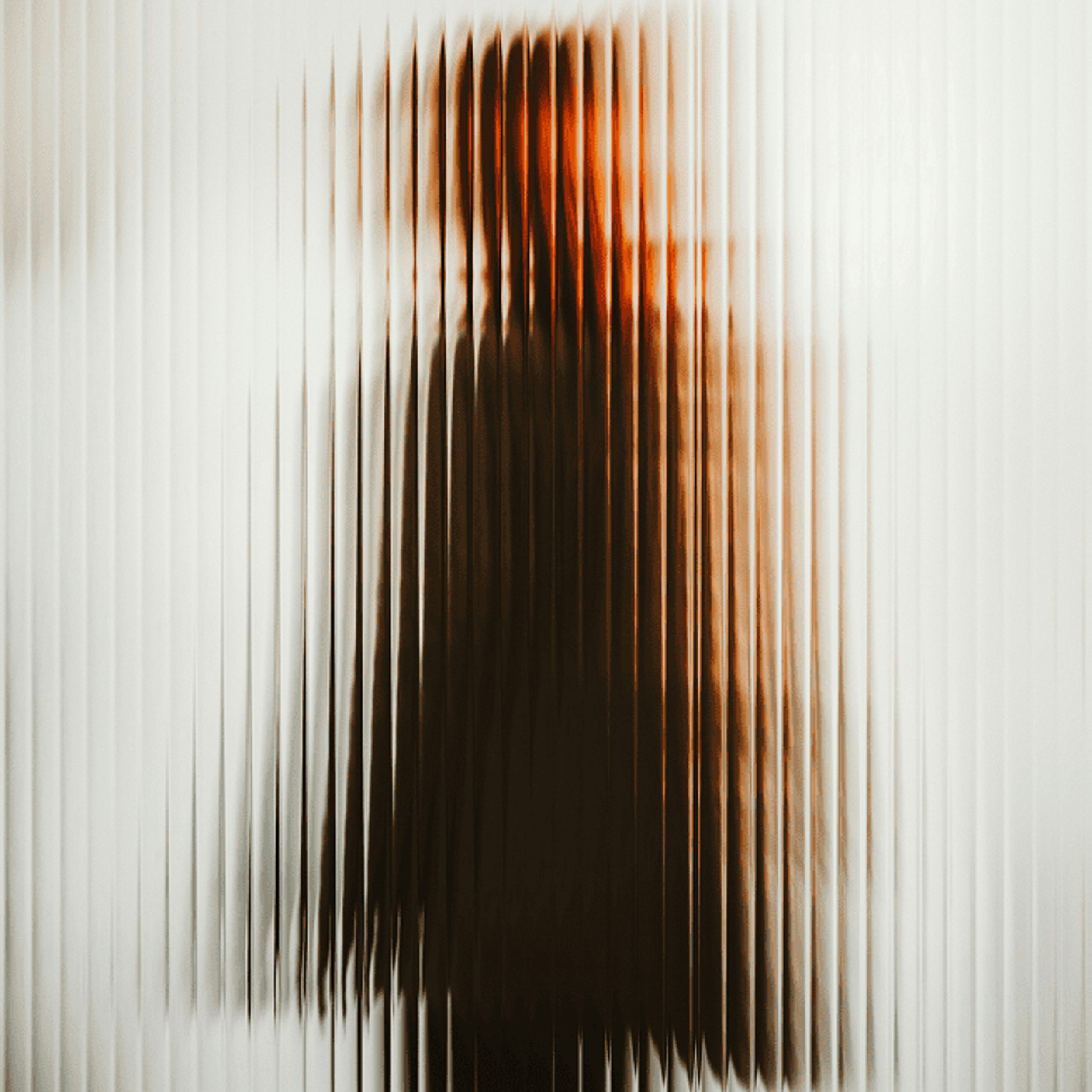 Dark silhouette behind a glass frame