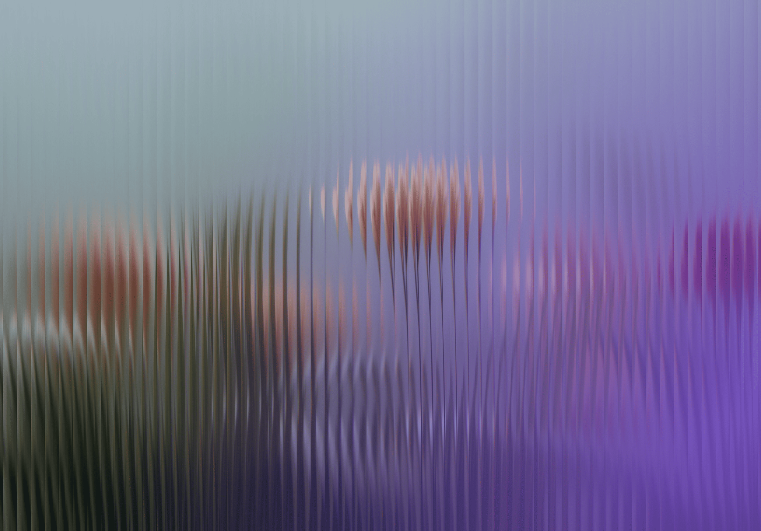 Blurry flowers behind textured glass with purple and blue tones