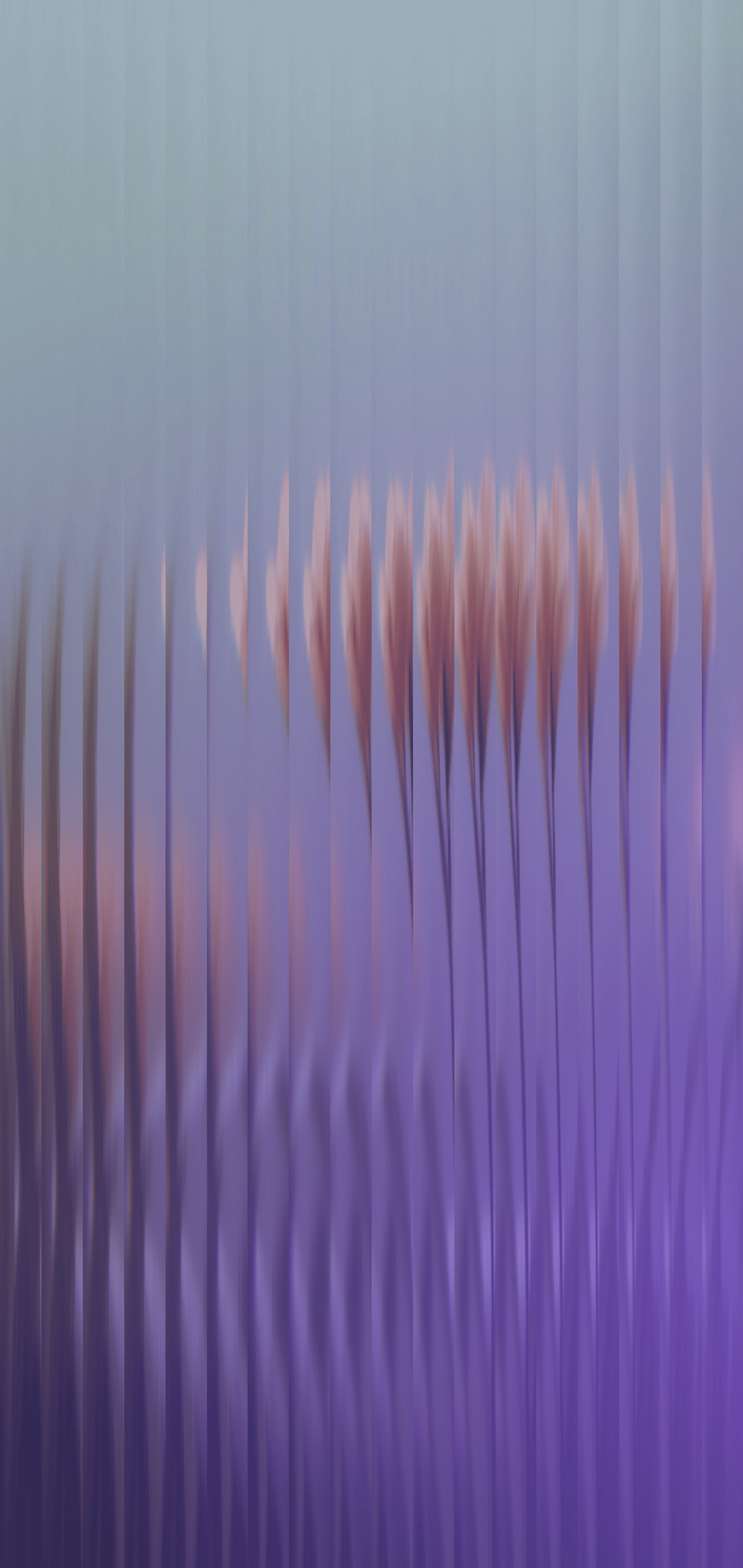 Blurry flowers behind textured glass with purple and blue tones